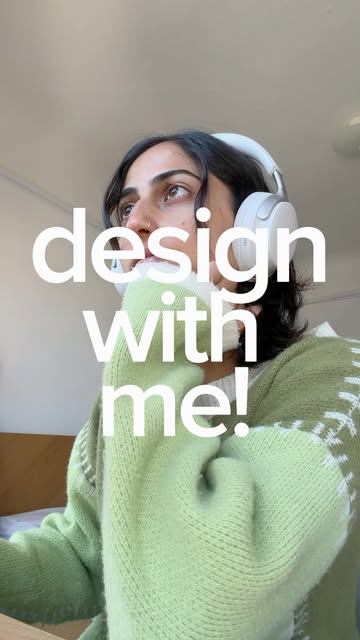 Sabina in a green sweater with design with me text